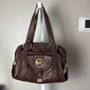 Michael Kors Brown, all leather‎ bag with gold trim. Very good preowned bag.